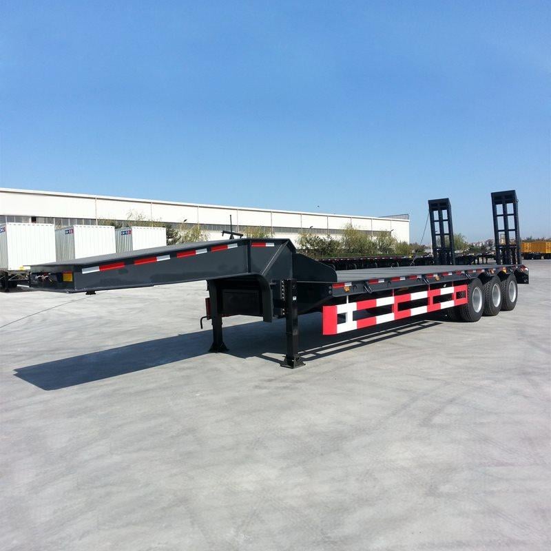 Low bed semi trailer for construction machinery transport