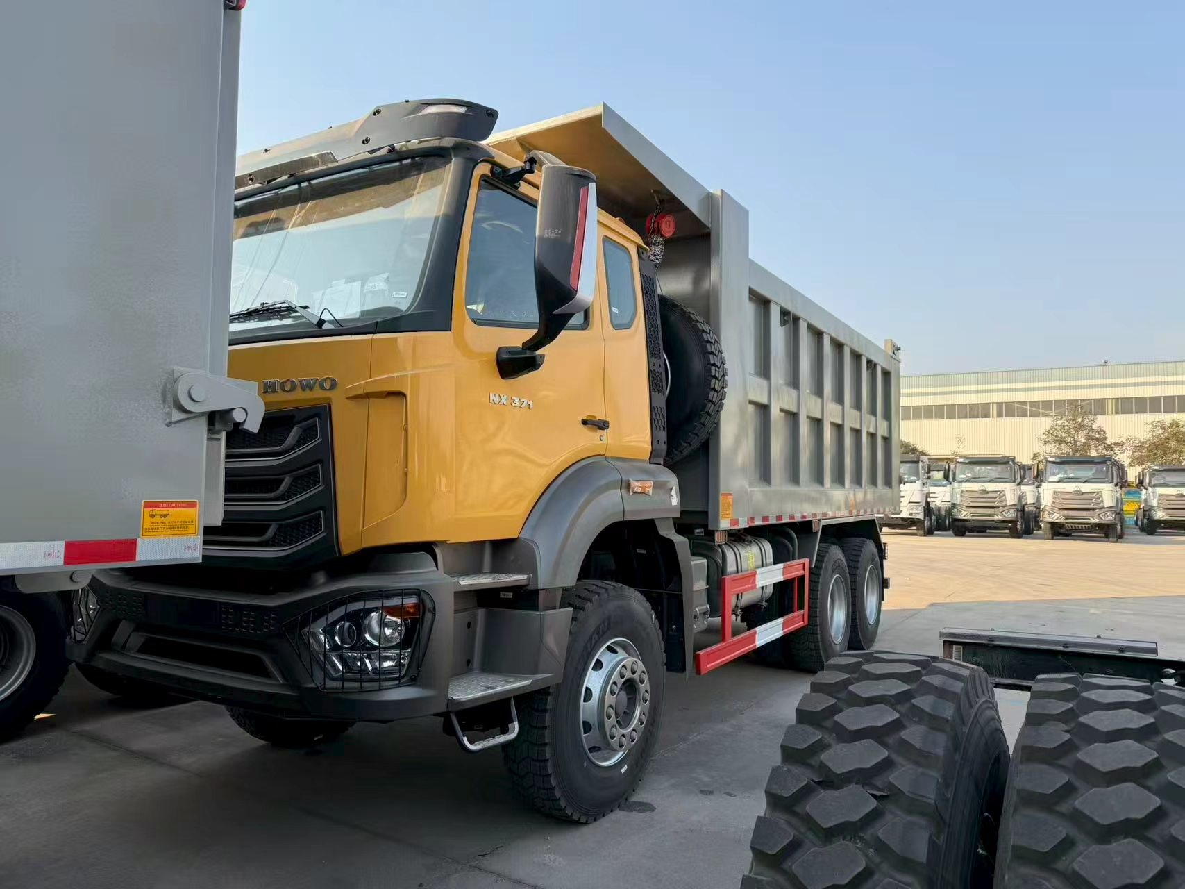 SINOTRUK HOWO NX 6X4 Heavy Duty Dump Truck with 371 Horsepower and 20 CBM Dump Box for Sale.