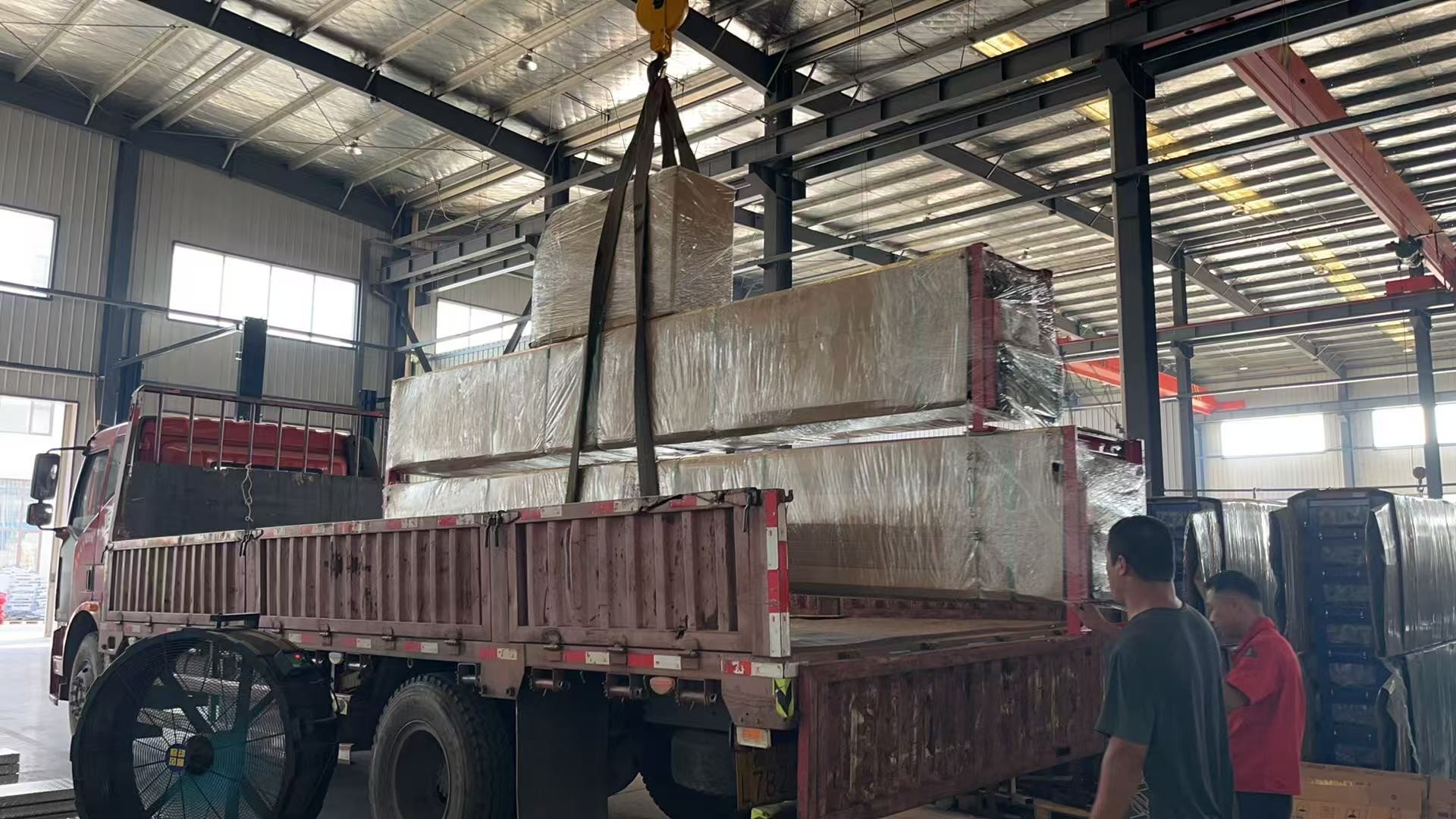 Loading packaged equipment for dispatch..png