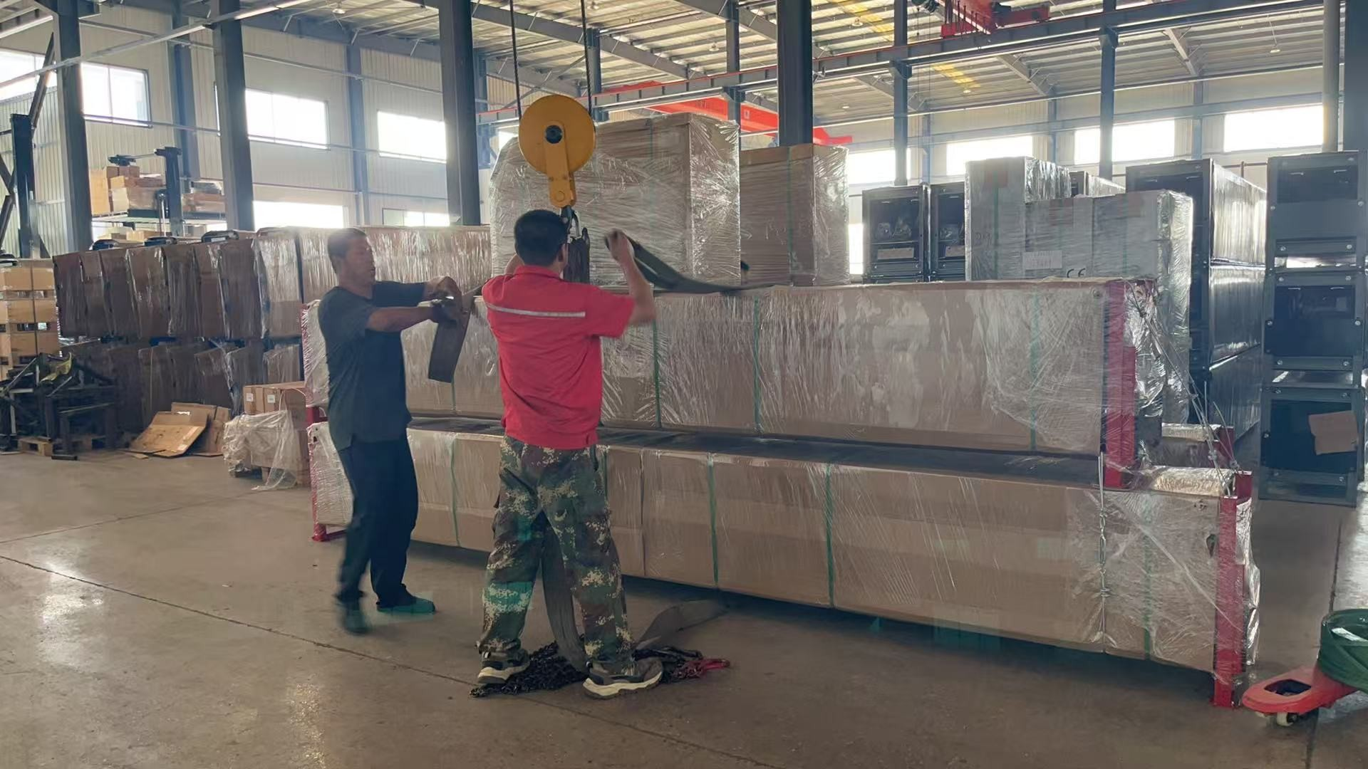 Packaged equipment being prepared for shipment at the factory..png