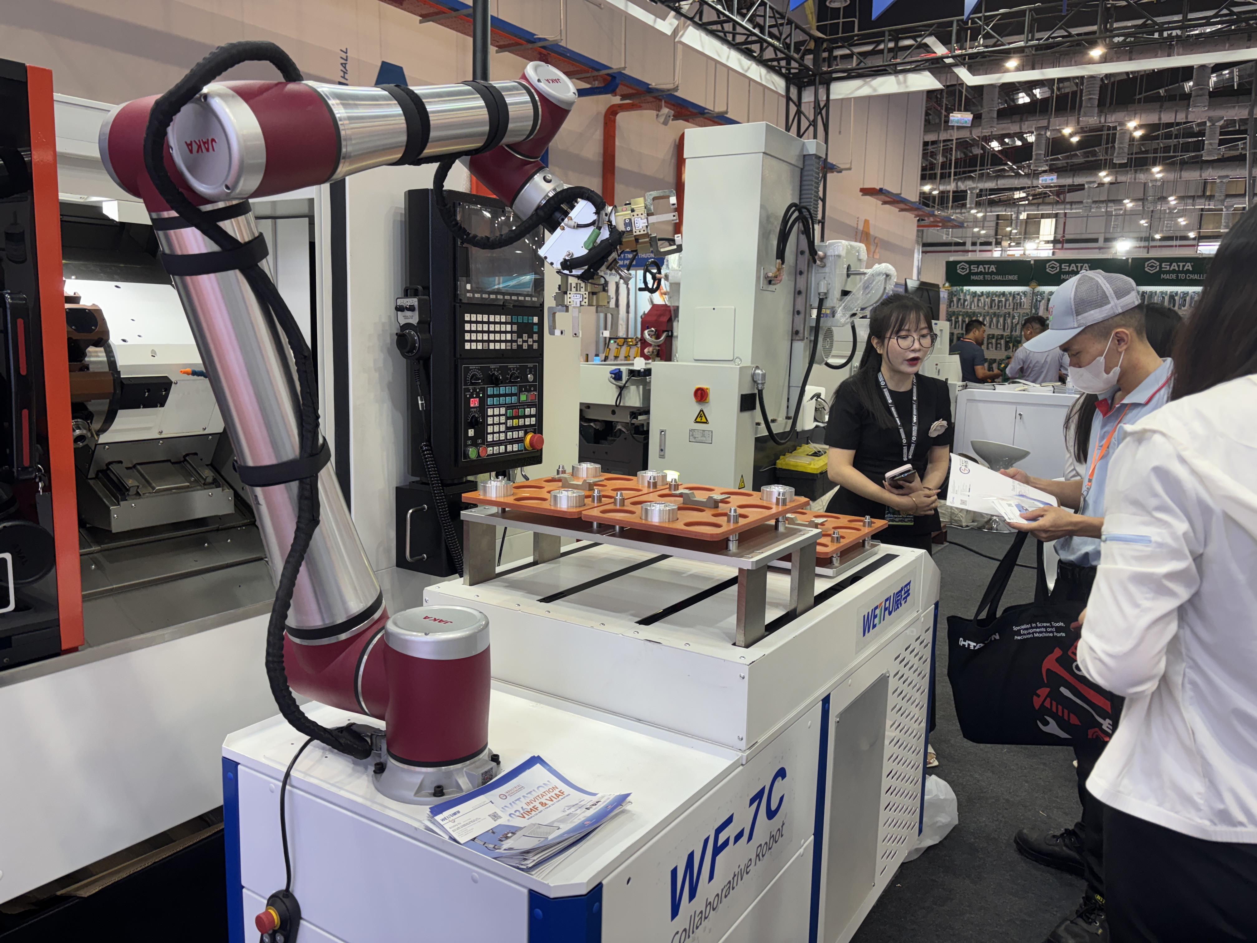 A WEIFU collaborative robot CNC workstation is showcased live at VIMF & VIAF 2026 in Binh Duong