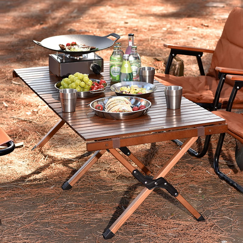 Why do travelers choose roll up table for camping trips?