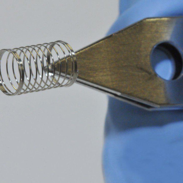 Precision Manufacturing under Pressure - Development of Medical Micro Contact Springs