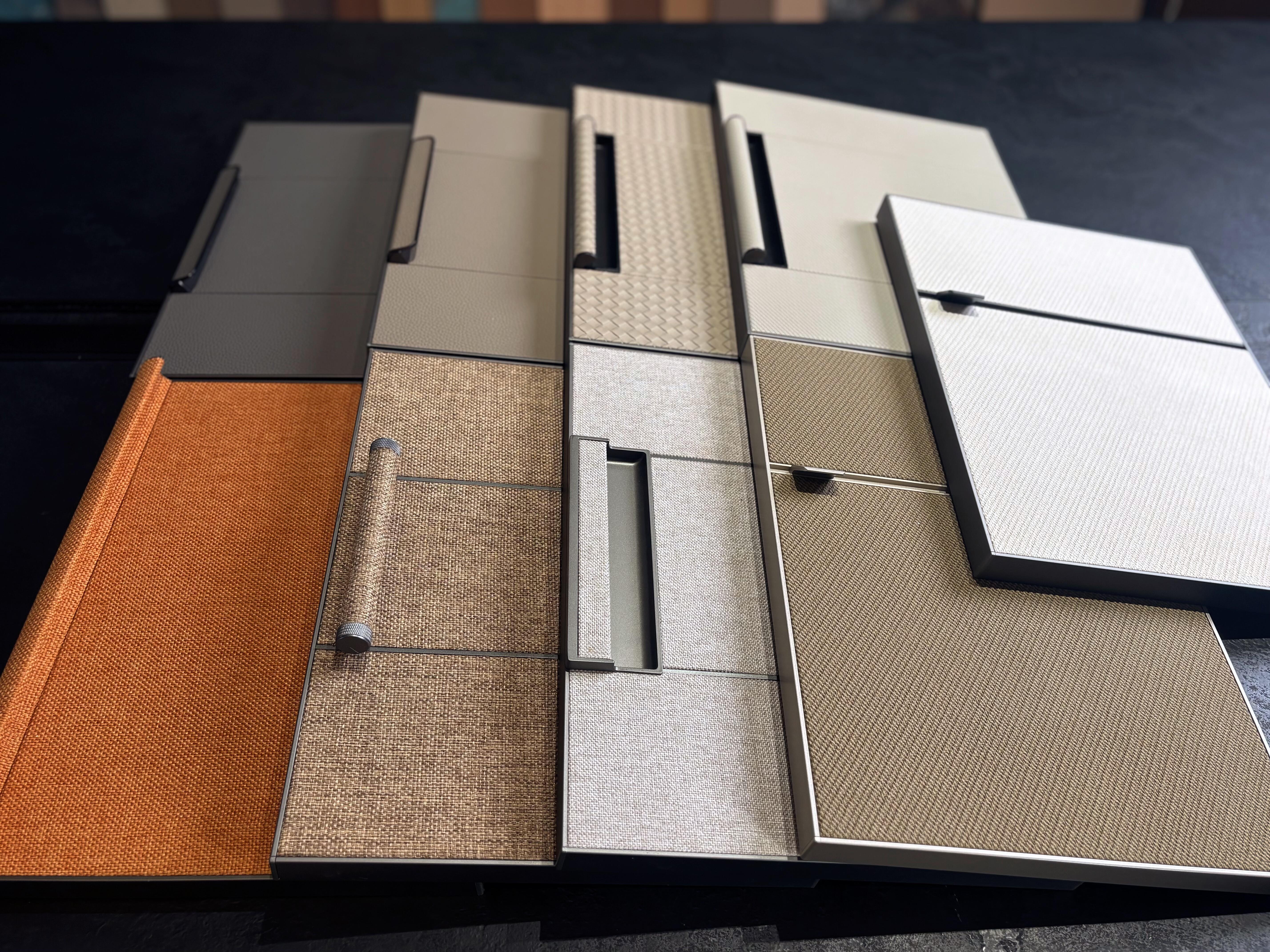 Leather finish wardrobe door samples with aluminum frames and handles