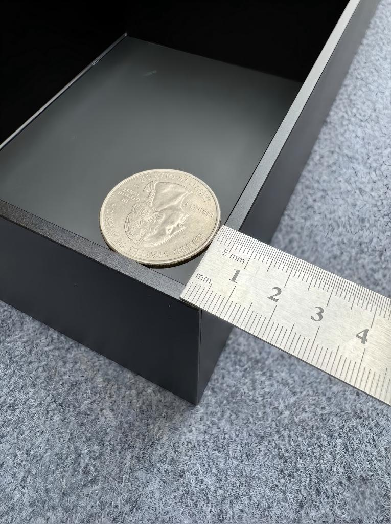 Close-up of ultra-slim matte aluminum shelf edges with concealed LED lighting