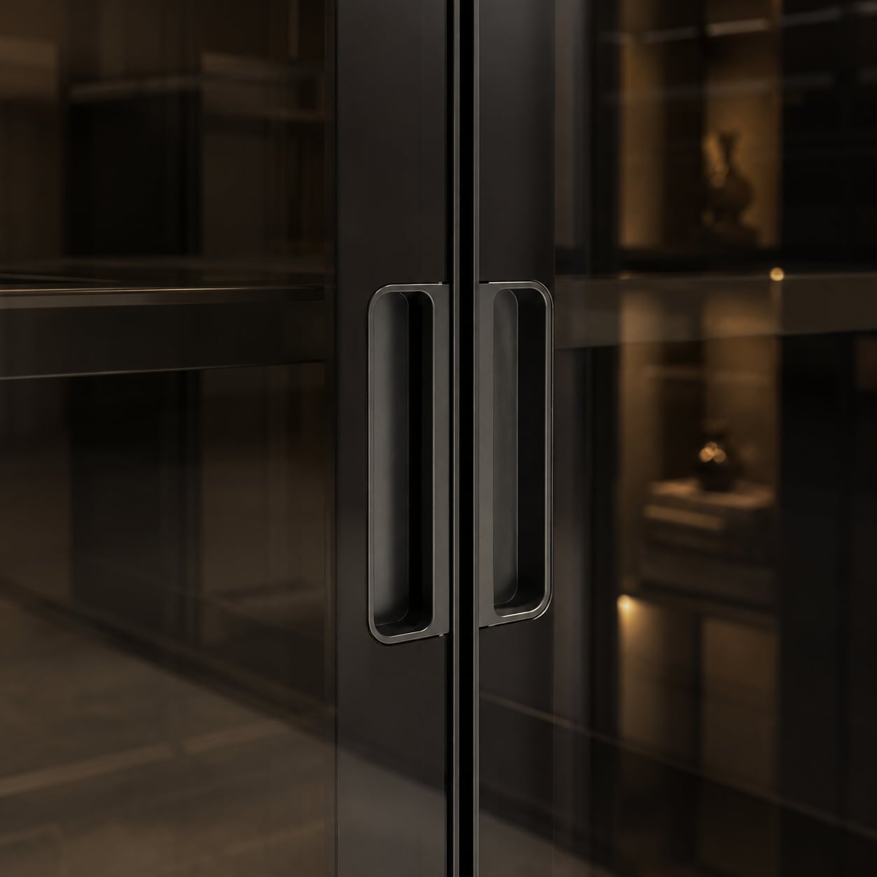Recessed black handle detail on smoked glass wine cabinet doors