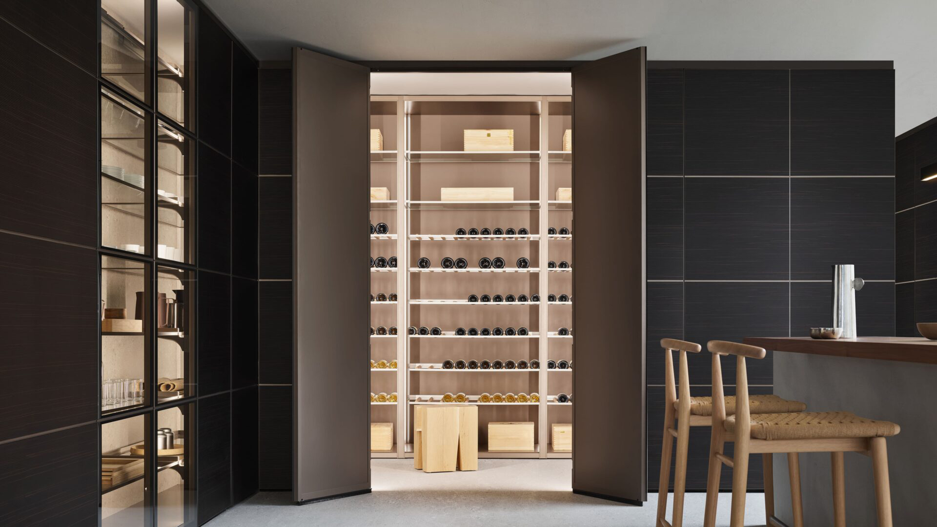 Concealed wine room entrance with illuminated modular wine storage beyond