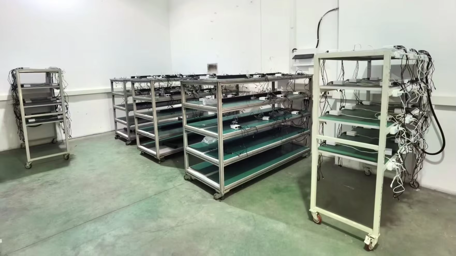 Battery aging and charge cycle test racks for Fitco cordless tire inflators