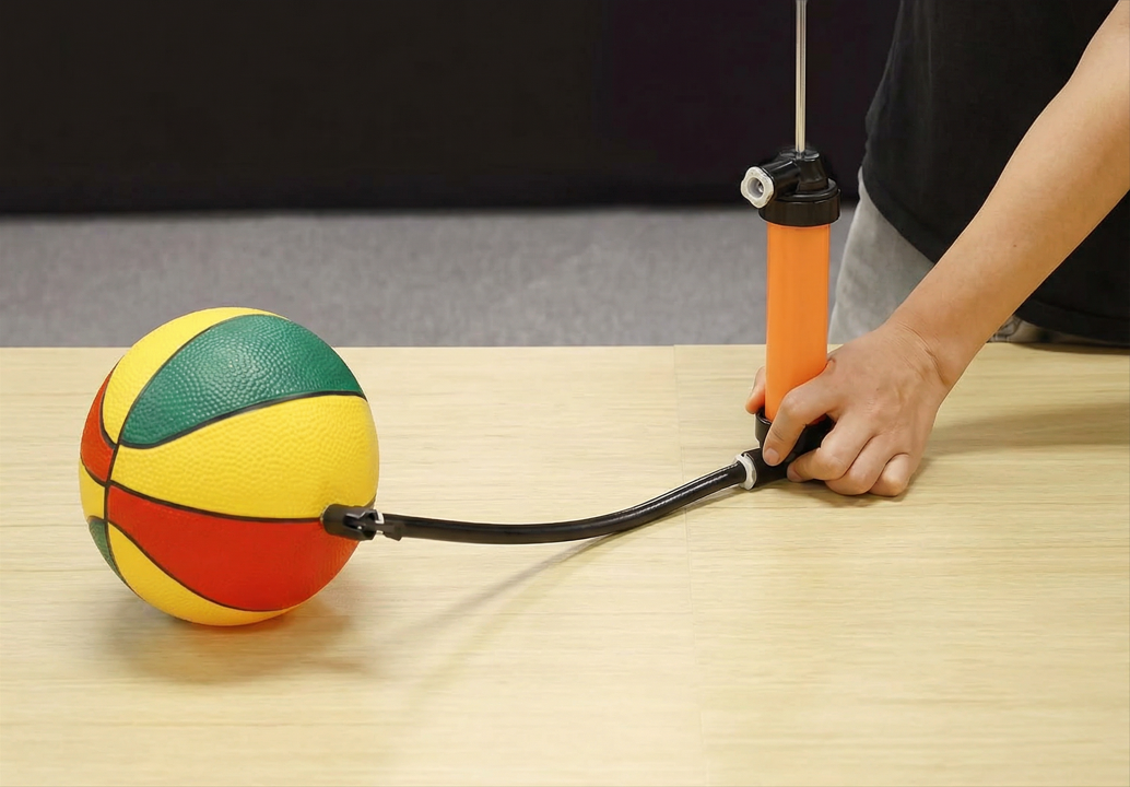 Manual siphon pump inflation needle used to inflate sports balls and balloons