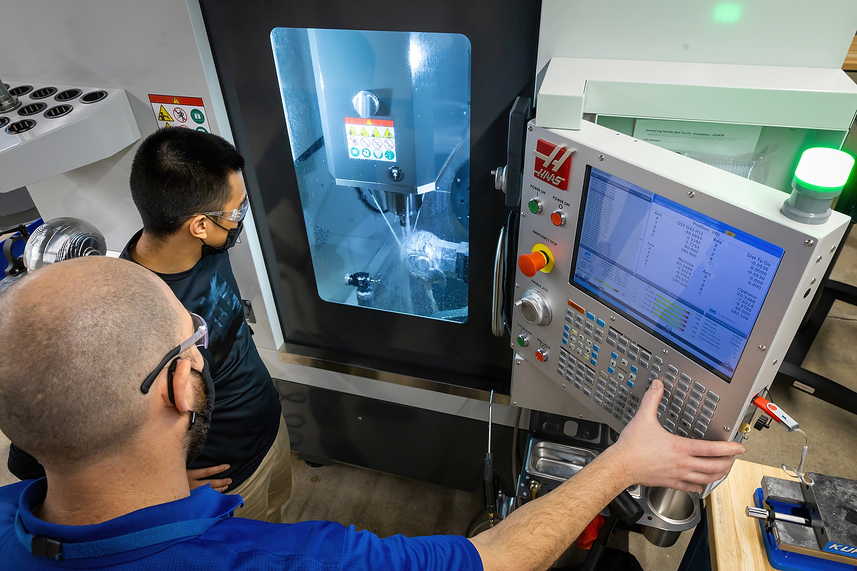 modern cnc machining center producing precision components with computer controlled accuracy