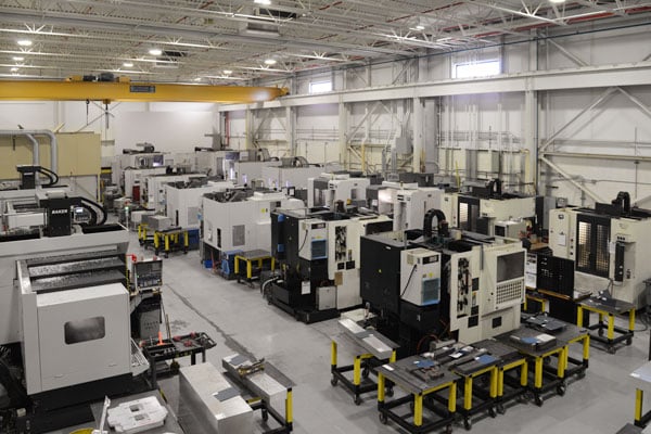 modern cnc machine shop with precision milling equipment in full operation