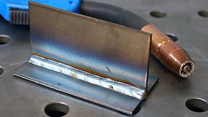 inspecting a practice weld to spot defects and improve technique