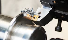 deburring a drilled metal hole for a cleaner finish