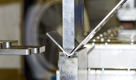modern fiber laser system performing precision sheet metal cutting in an industrial fabrication facility