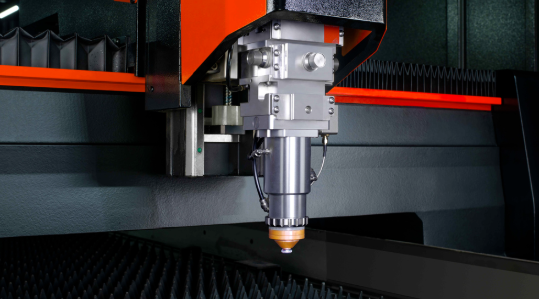 fiber laser precision cutting aluminum sheet with sparks illuminating the manufacturing process