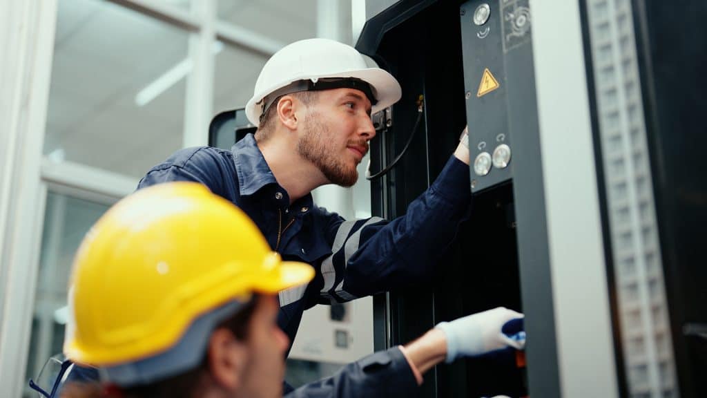 technician performing preventive maintenance on cnc equipment to ensure precision and uptime