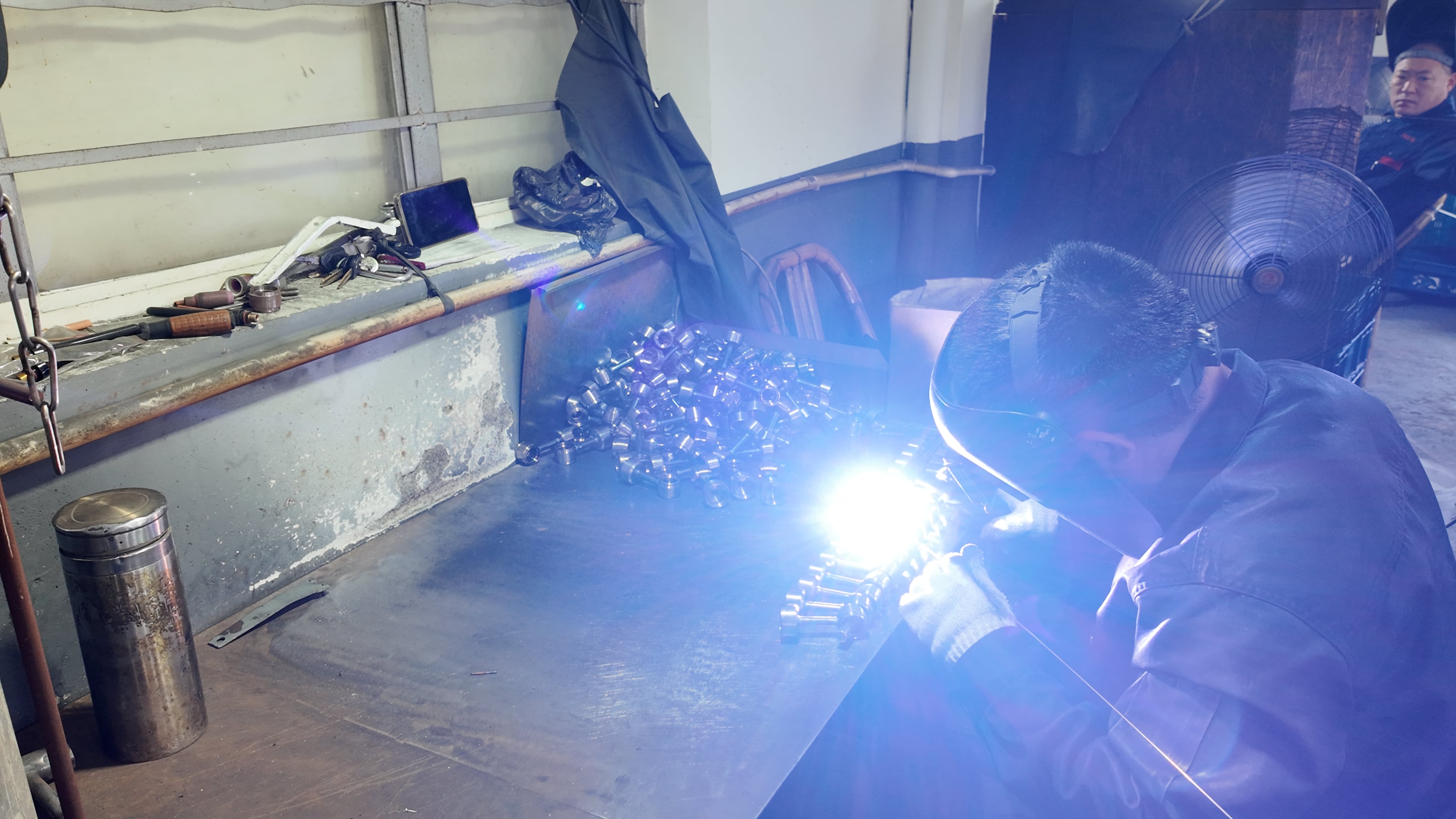 gas and gasless wire feed welding setups in one workshop