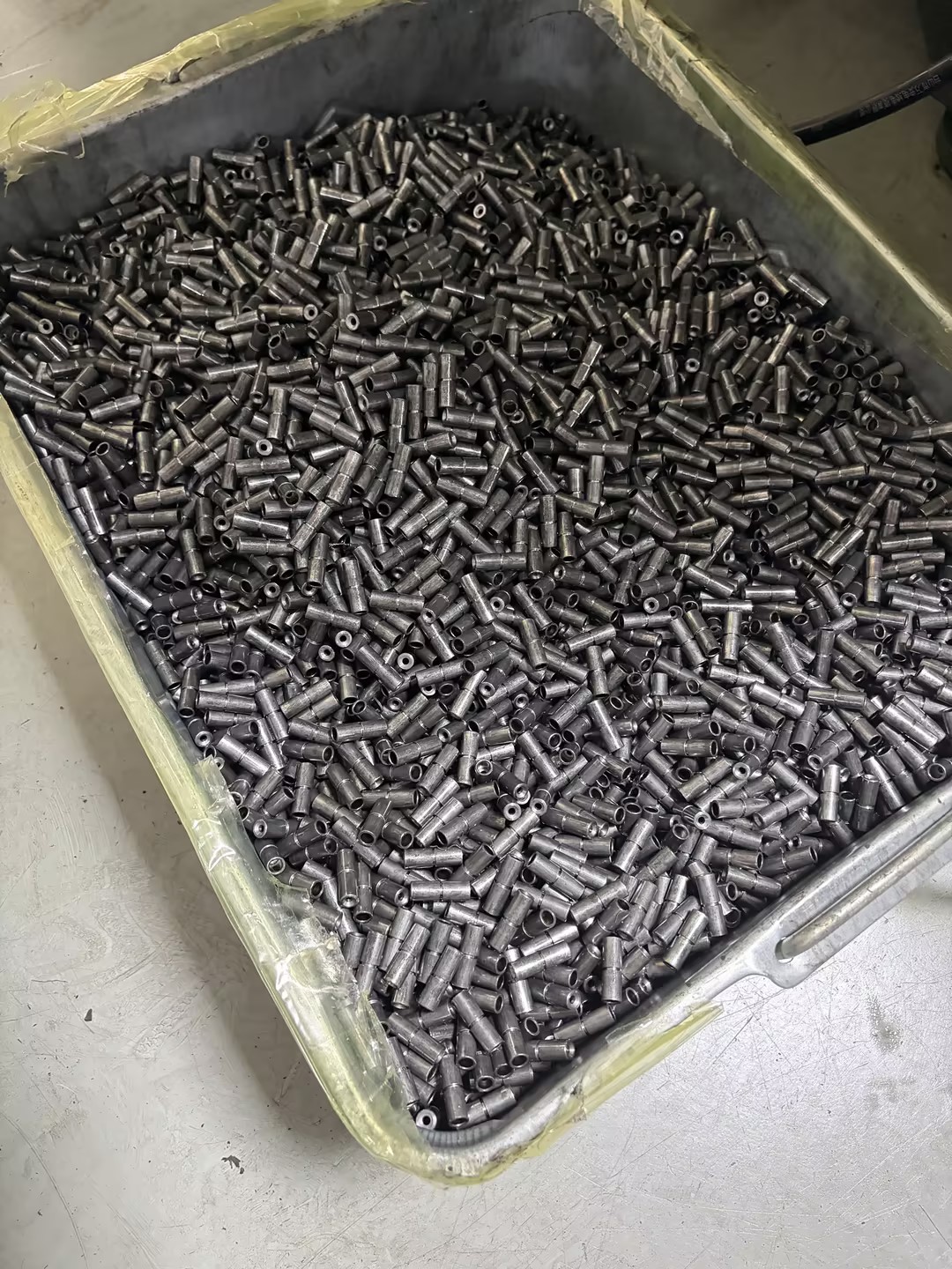 Production batch of 20CrMo automotive locking pins before final ultrasonic cleaning