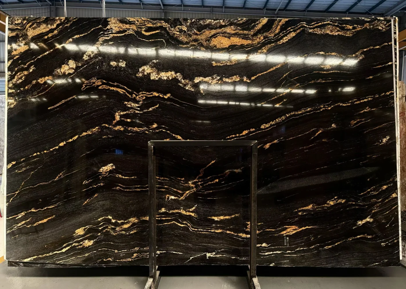 Gold Silk Granite slab display with linear gold veining