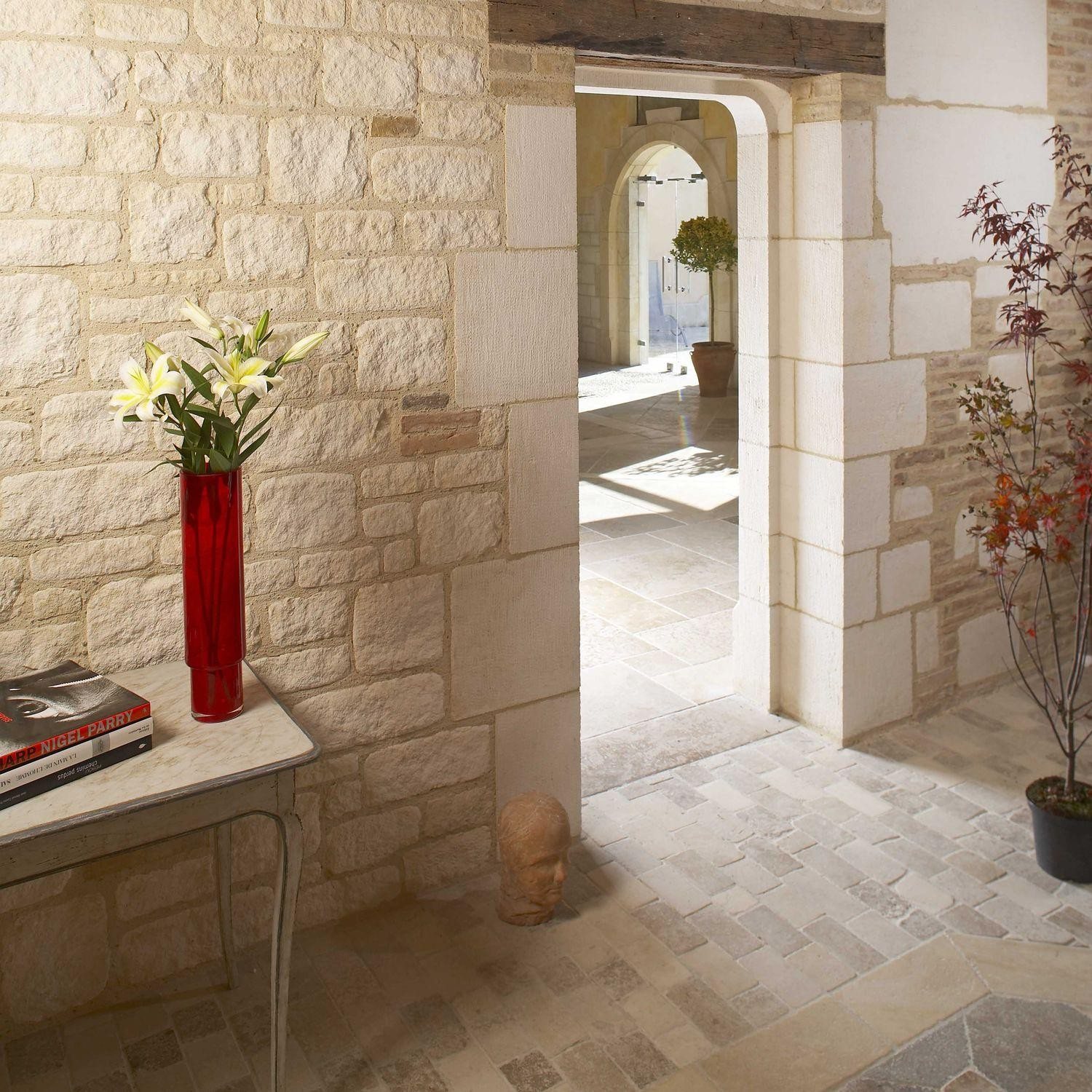 Roman Beige Limestone wall cladding creating a warm architectural interior atmosphere