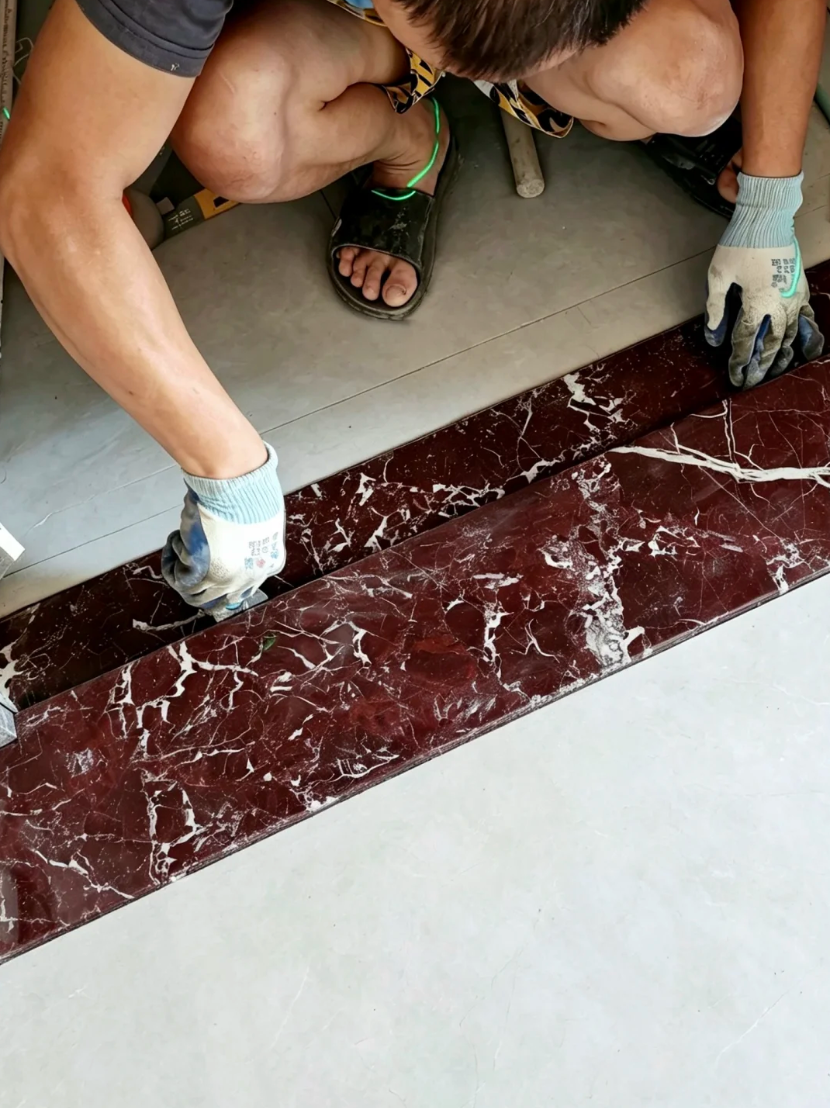 red marble threshold stone installed at doorway