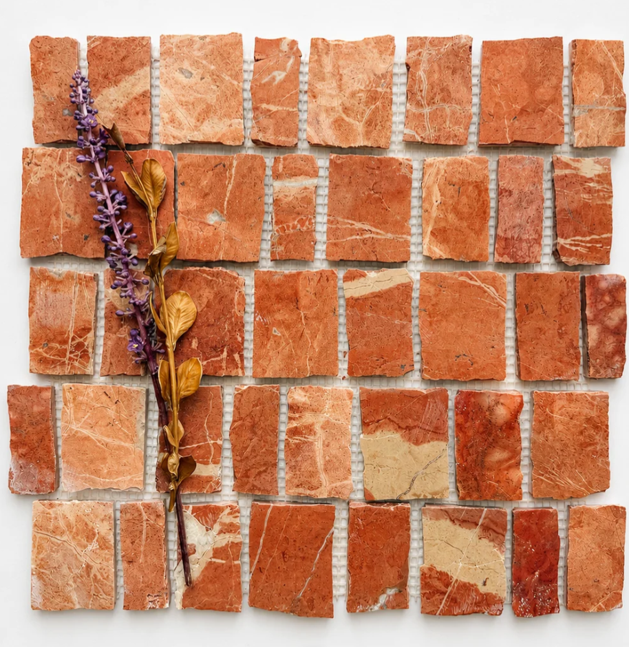 Hand-cut marble mosaic detail using red natural stone
