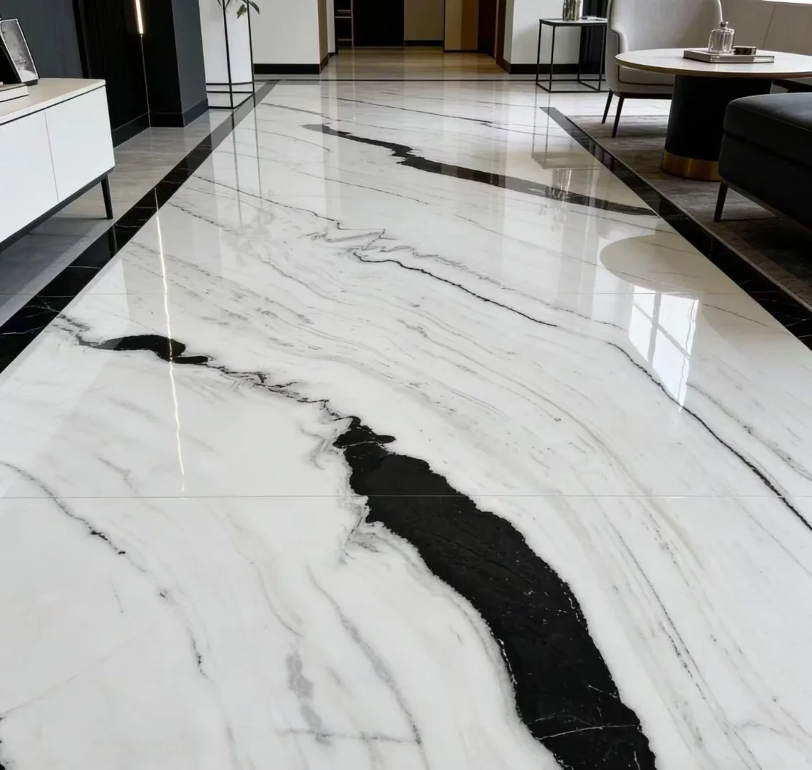 Large-format Panda White Marble flooring with a flowing black vein
