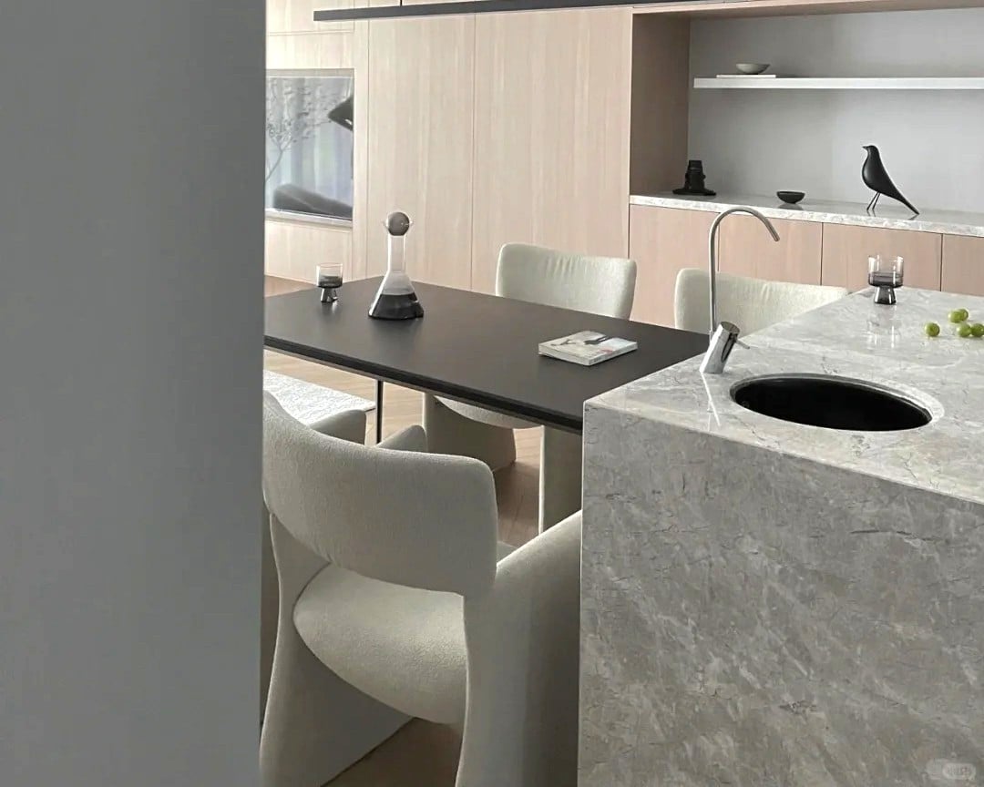 Castle Gray Marble kitchen island with waterfall side panel in an open-plan kitchen.jpg