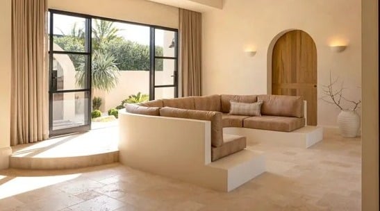 Warm layered natural stone inspired interior architecture