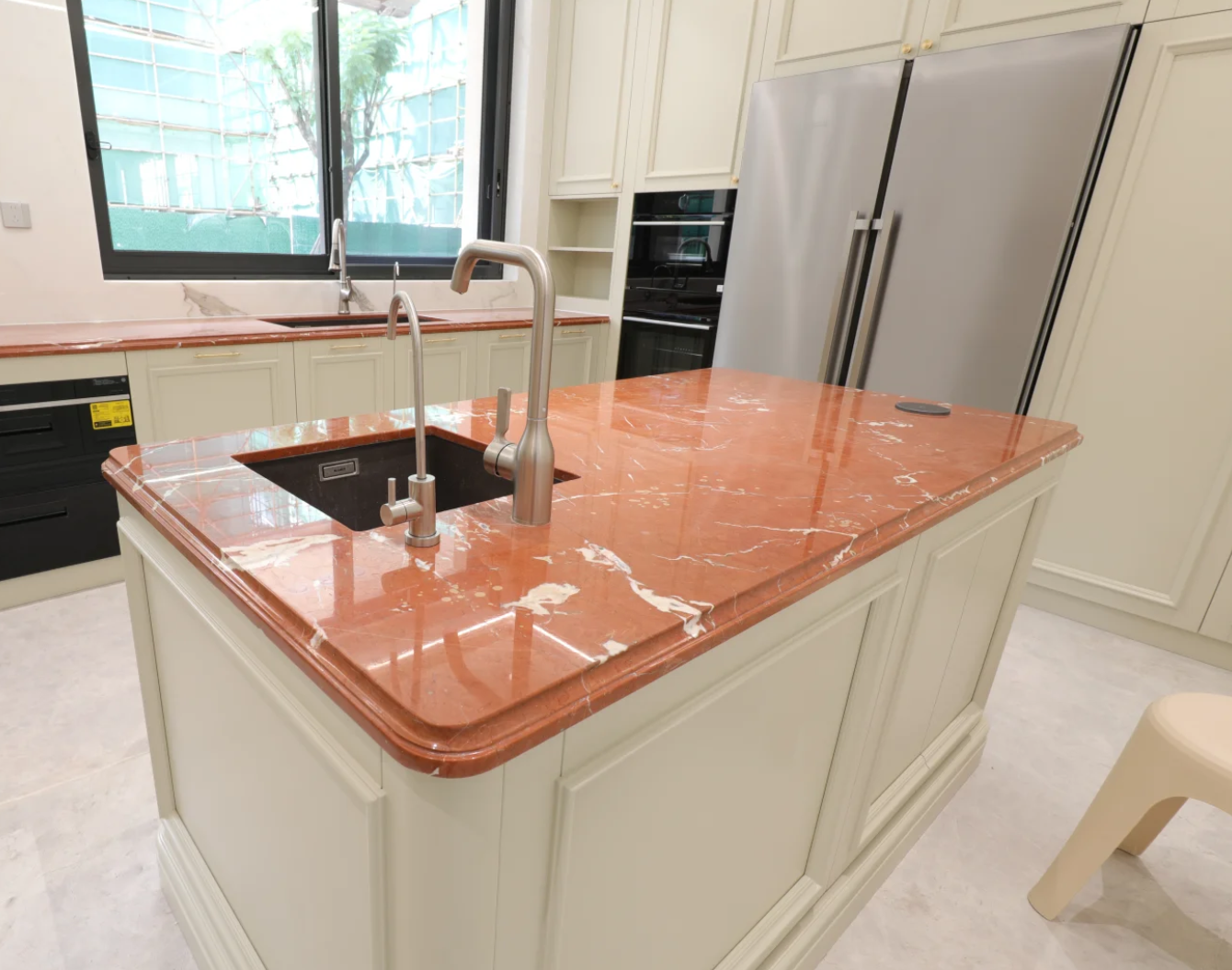 Polished Rojo Alicante marble countertop with sink and edge profile