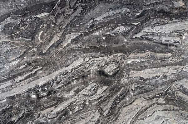 Close-up veining detail showing the polished texture and natural movement of Arabescato Orobico Grigio marble.