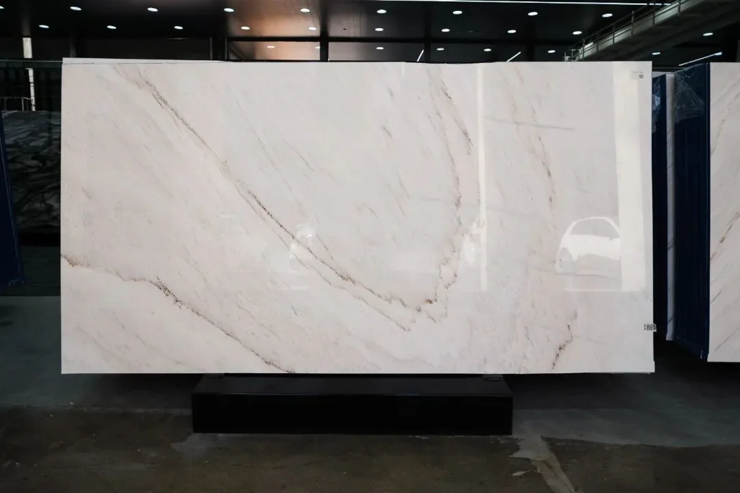 White Gold Sand Marble slab with a bright cream background and soft branching grey veins
