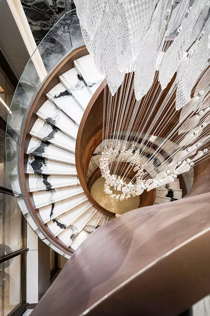 Curved staircase with individually cut Panda White Marble treads