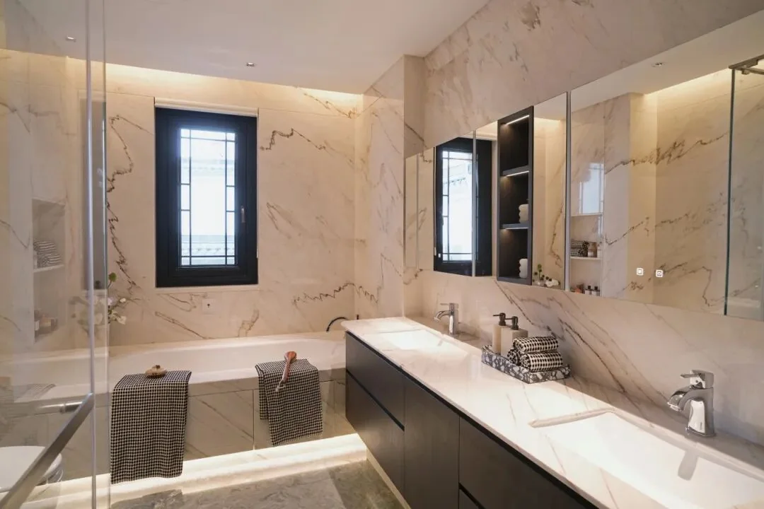 Luxury bathroom with White Gold Sand Marble wall panels and vanity backsplash