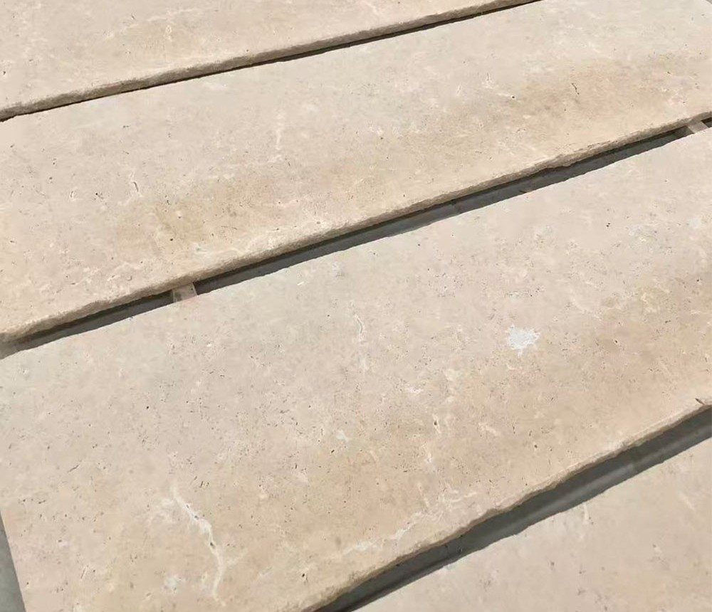 Close-up detail of Roman Beige Limestone showing natural pores and warm beige tone