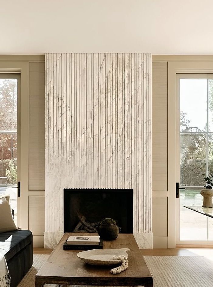 Fluted marble fireplace surround for modern living room