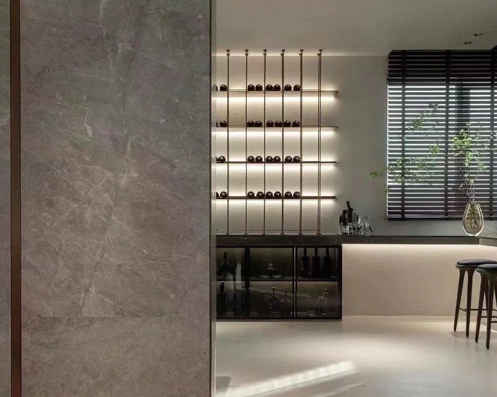 Castle Gray Marble TV feature wall with fine white veining in a contemporary interior.jpg