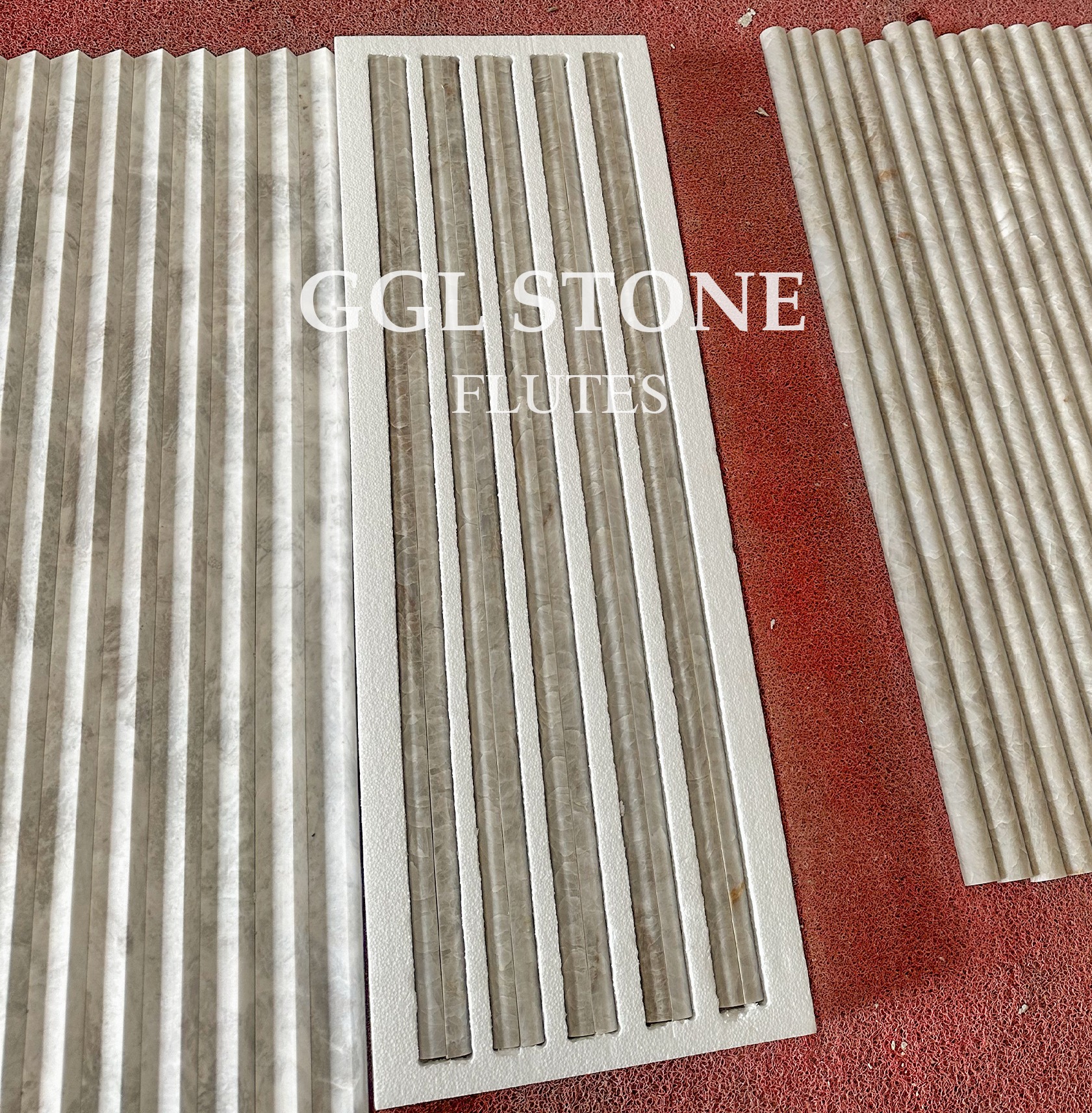 Commercial lobby interior featuring full-height Taj Mahal Quartzite stone flute wall cladding