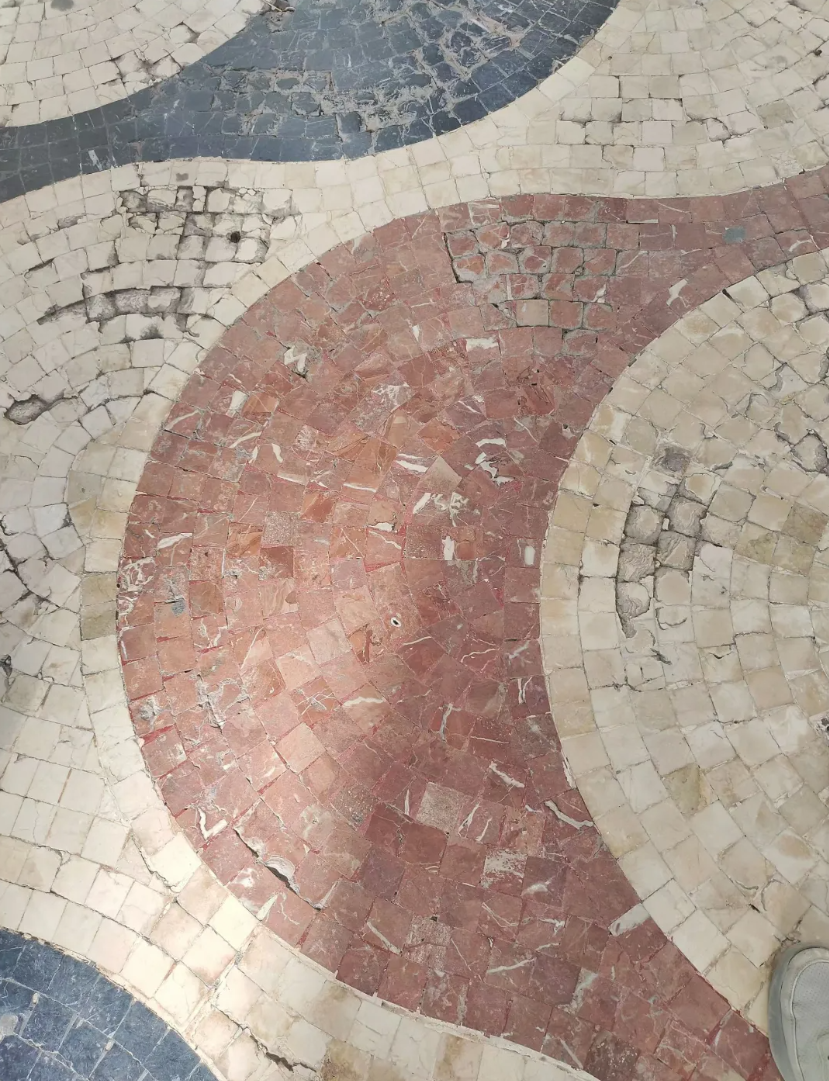 Rojo Alicante red marble surface with natural white veining