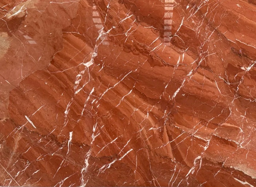 Geometric floor made with Rojo Alicante and white marble