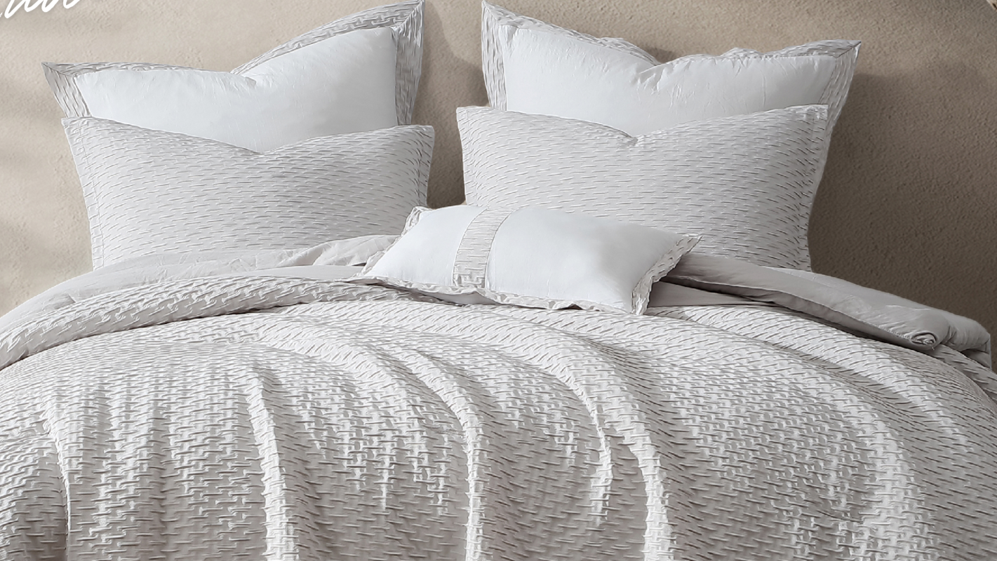 honi-white-textured-bedding-closeup-layered-ruffles-1.png