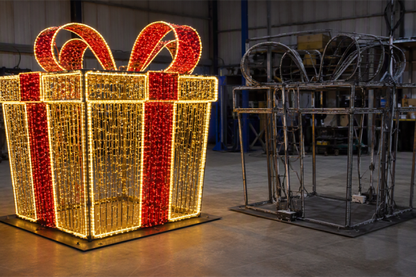 Custom illuminated Christmas gift-box sculpture with visible rope-light detailing