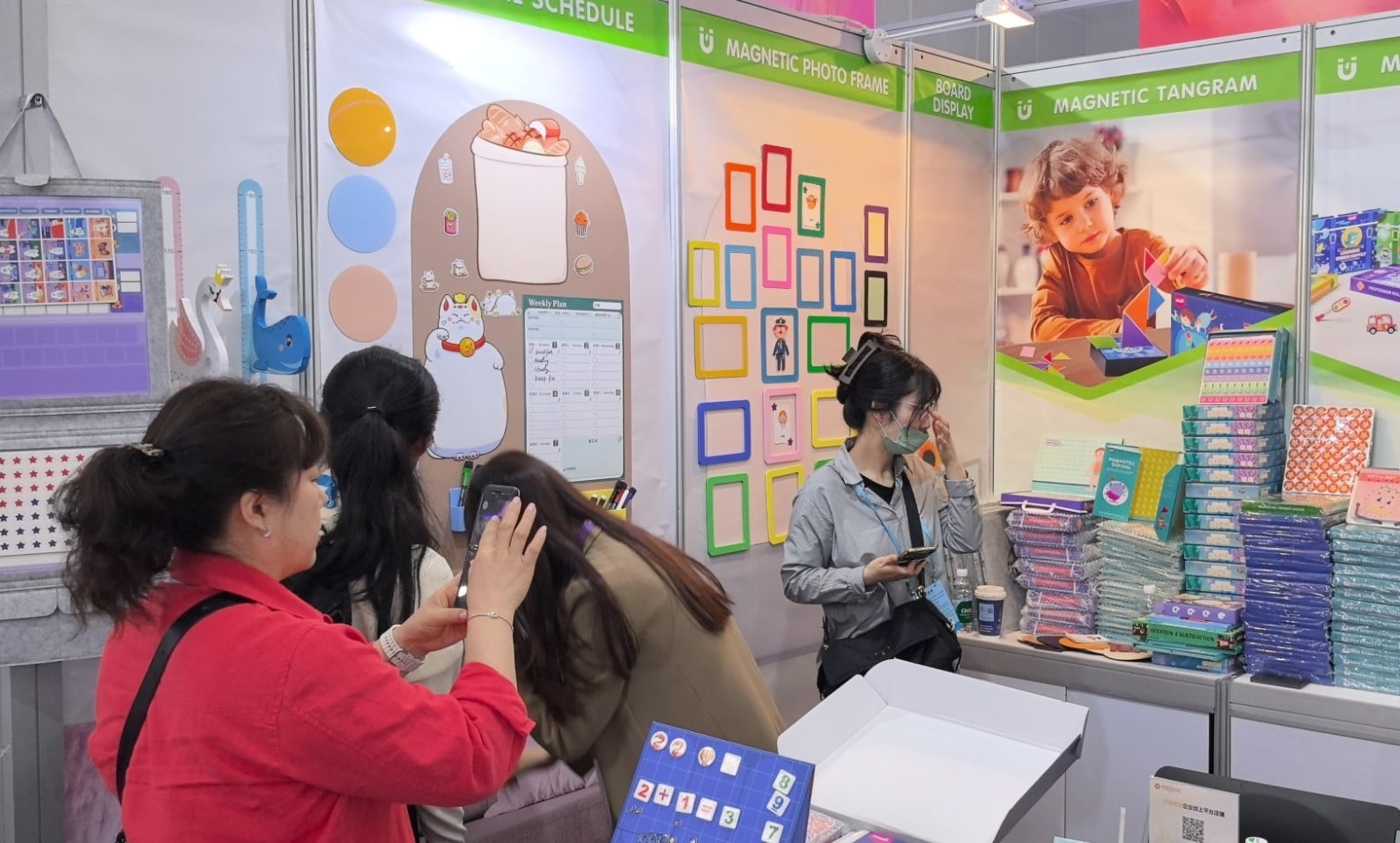 Visitors photograph the Magnetic Photo Frame wall