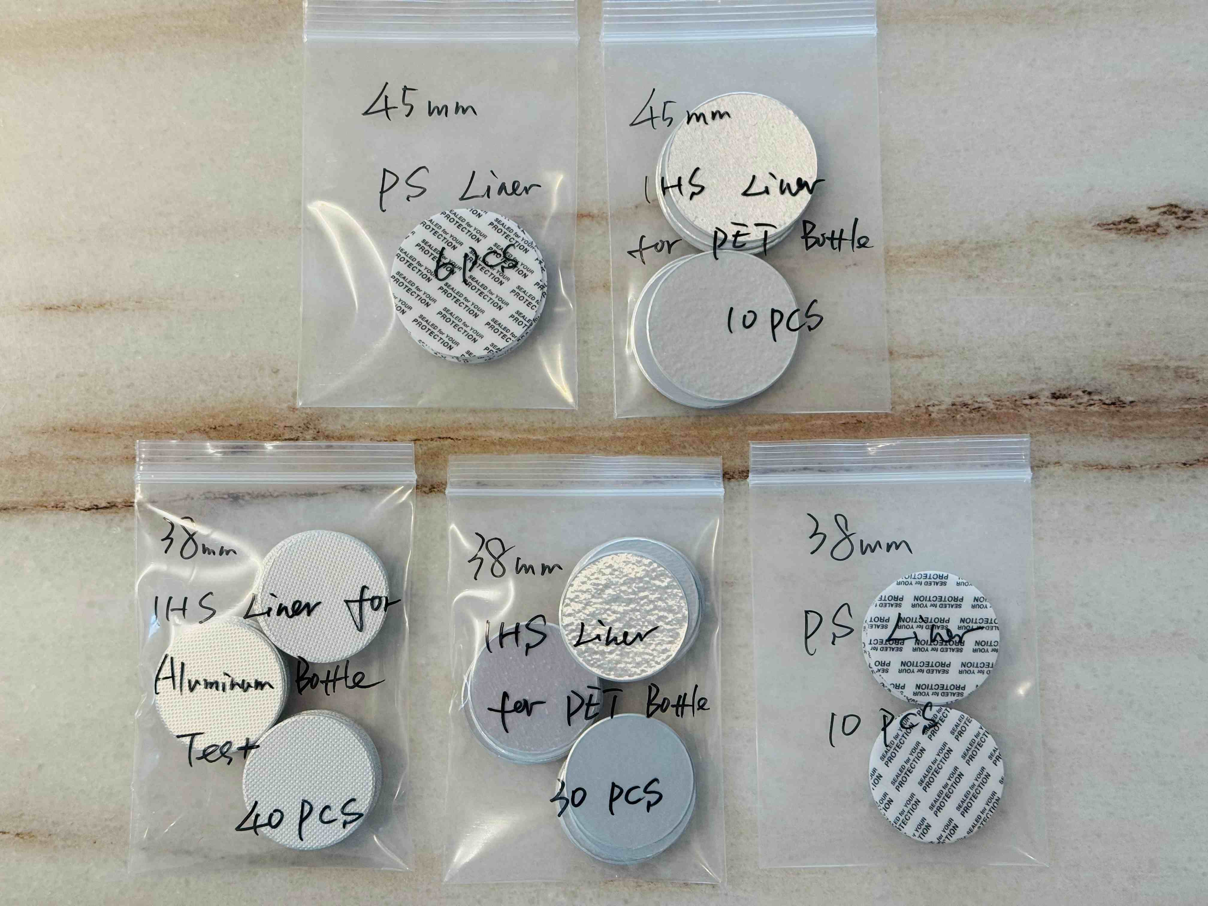 uniseel-sealing-liners-ihs-ps-pet-aluminum-bottle-testing.jpg