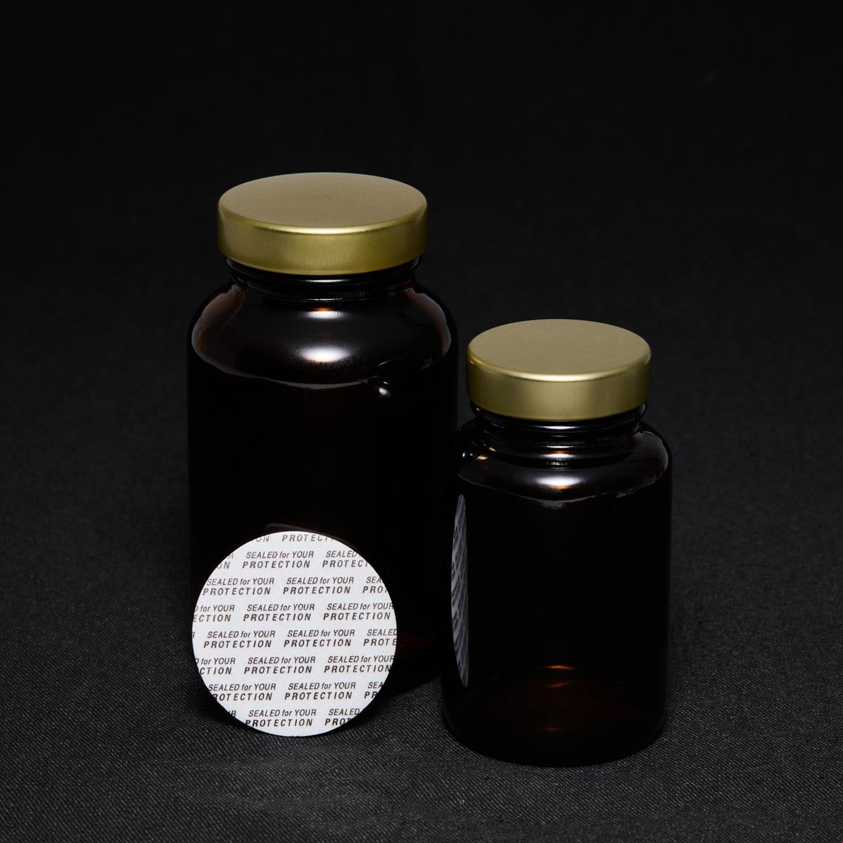 uniseel-ps-liner-gold-caps-amber-glass-bottles.jpg