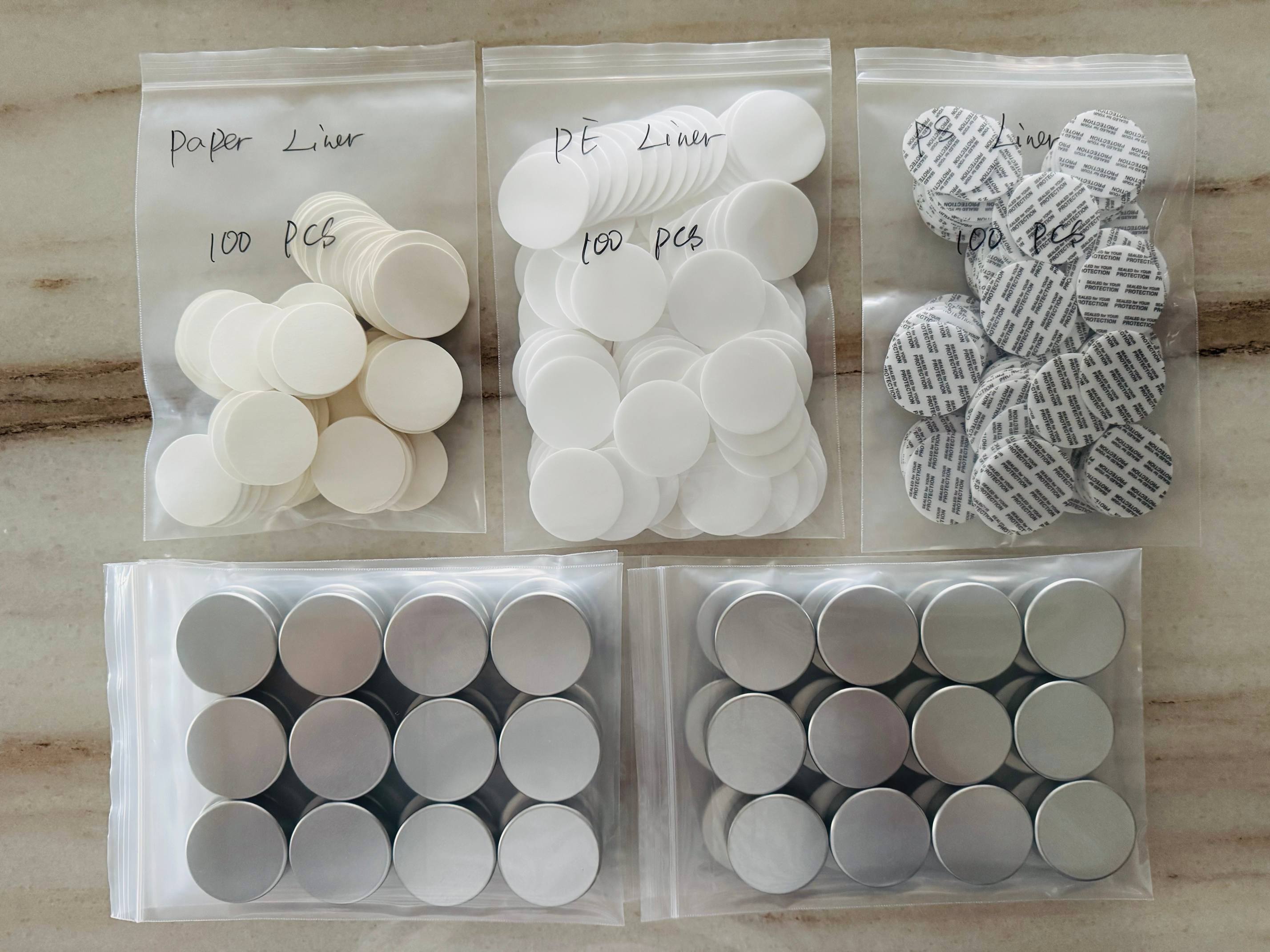 uniseel-paper-pe-ps-liner-comparison-aluminum-bottles-samples.jpg