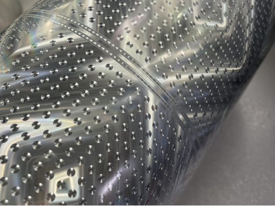 How does holographic printing enhance the perceived value of products?