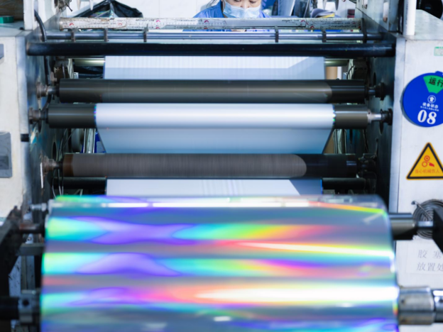 Holographic film running through a foil production line