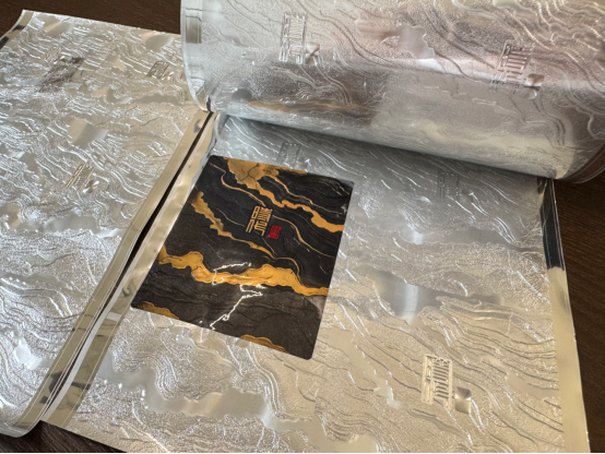 Foil adhesion test samples on paper and plastic substrate surfaces