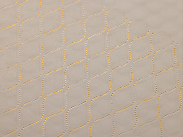 Holographic foil pattern texture shown on a packaging surface